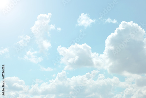 Fototapeta Naklejka Na Ścianę i Meble -   Sky. White clouds in a light blue sky. The sky is in very light pastel colors. Heaven background.