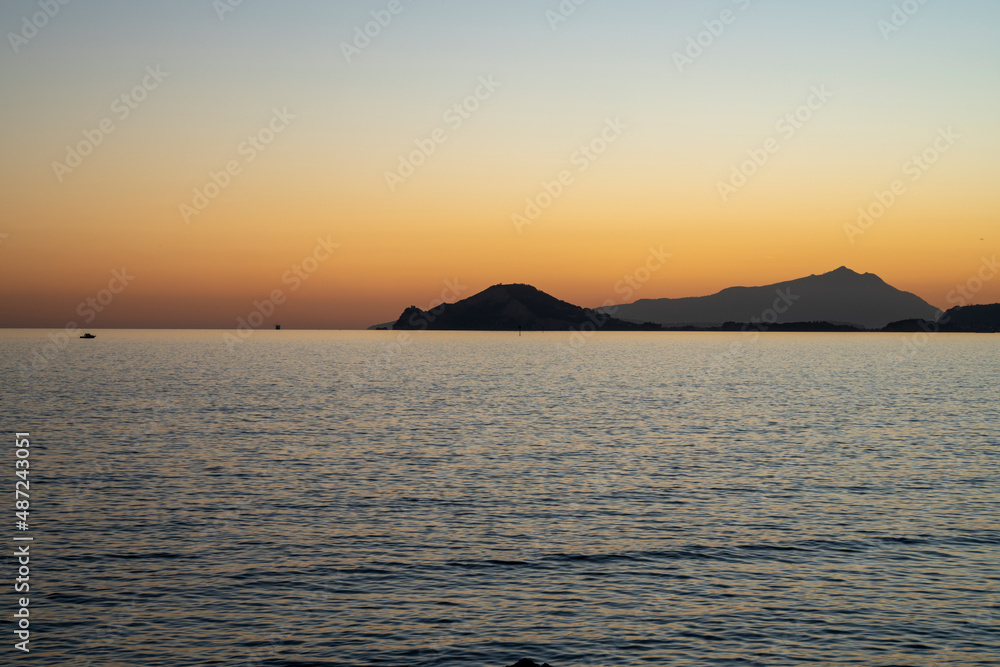 Sunset at sea. Sea landscape. Variety of colors and hues of the sun. Bagnoli, Naples, Italy. Sunset at sea. Sea landscape. Variety of colors and hues of the sun. Bagnoli, Naples, Italy.