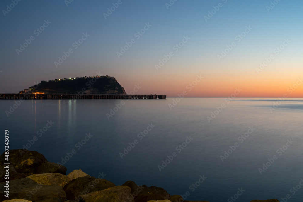 Sunset at sea. Sea landscape. Variety of colors and hues of the sun. Bagnoli, Naples, Italy.