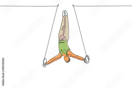 One continuous line drawing of young man exercising steady rings at gymnastic. Gymnast athlete in leotard. Healthy sport and active concept. Dynamic single line draw design vector illustration graphic
