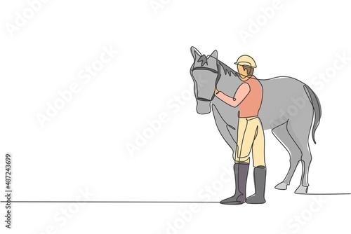 One continuous line drawing of young horse rider man rubbing and stroking horsehair. Equine pet care. Equestrian sport competition concept. Dynamic single line draw design vector graphic illustration