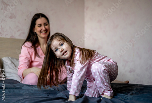 Happy loving family. Mother and her daughter are playing at home.