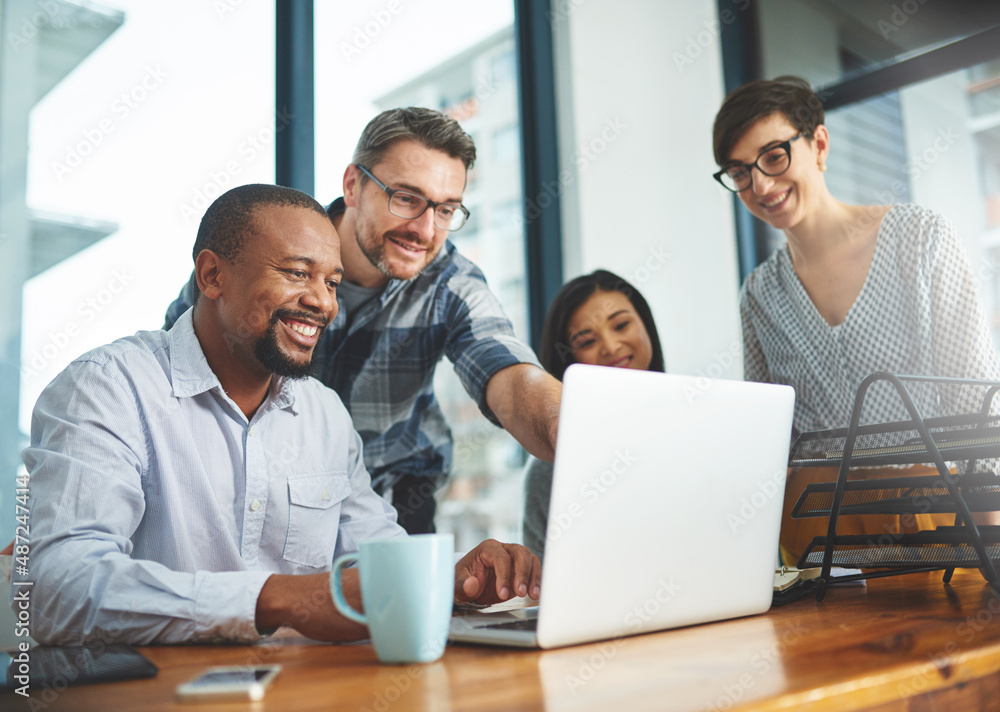 Working together to get the task done. Shot of businesspeople working together in the office. Working together to get the task done. Shot of businesspeople working together in the office.