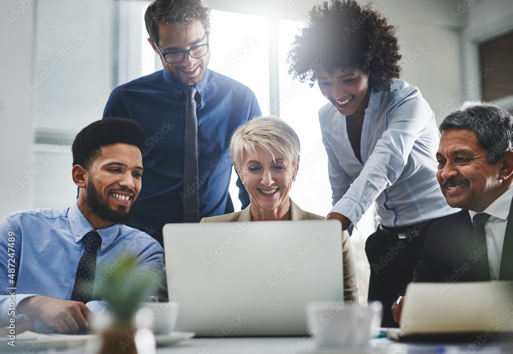 Look, we pop up first in the search engine. Shot of a group of businesspeople working together on a laptop. Look, we pop up first in the search engine. Shot of a group of businesspeople working together on a laptop.