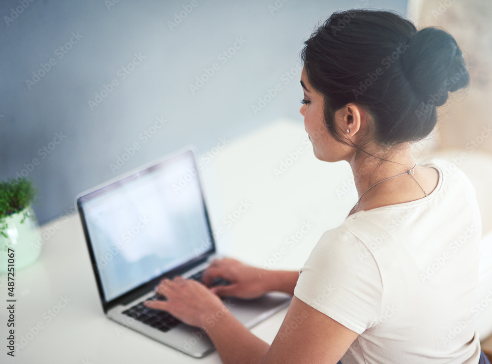 Shes an employee you can rely on. High angle shot of an attractive young businesswoman working on a laptop in her office. Shes an employee you can rely on. High angle shot of an attractive young businesswoman working on a laptop in her office.