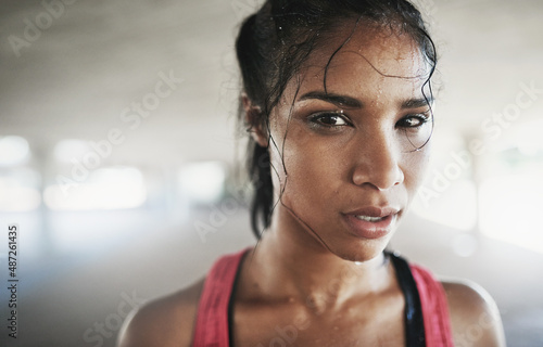 Time to get my fit on. Shot of a young woman getting fit outside.