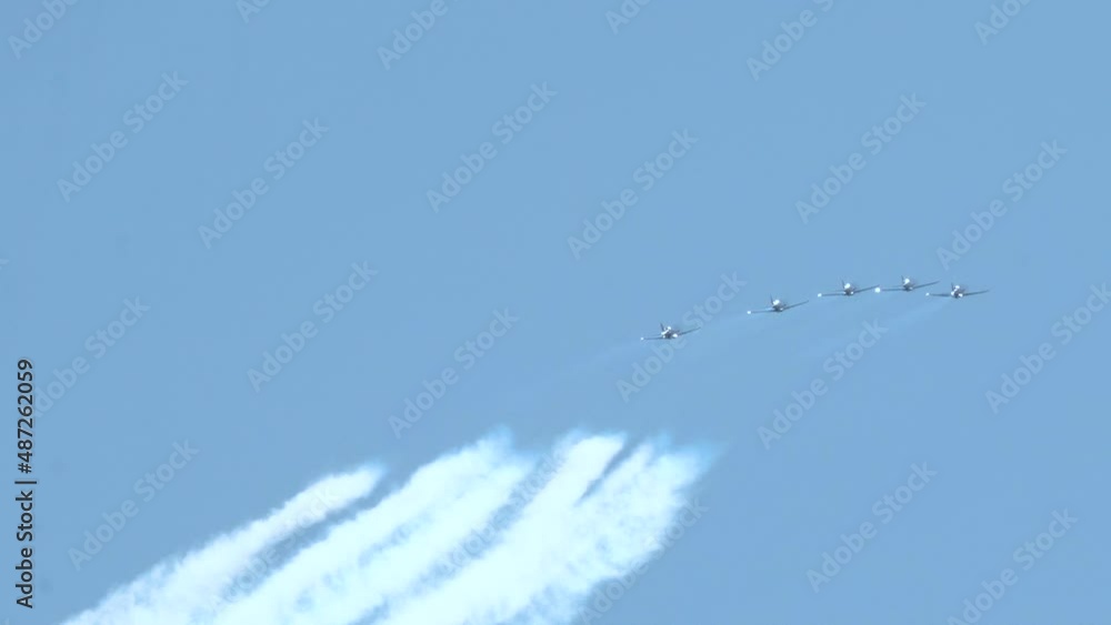 Aerobatic Maneuver - Five Single Aircraft In Formation Leave White Smoke Behind During Air Show In Gdynia, Poland. - wide shot Aerobatic Maneuver - Five Single Aircraft In Formation Leave White Smoke Behind During Air Show In Gdynia, Poland. - wide shot