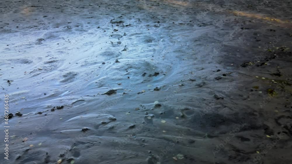 Aerial close shot of the muddy bottom of the river dried due to the global warming Aerial close shot of the muddy bottom of the river dried due to the global warming