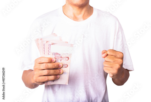 A man holding Thai banknotes on a white background, clipping paths