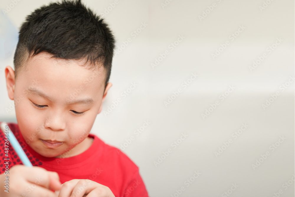 child writing in notebook for school child writing in notebook for school