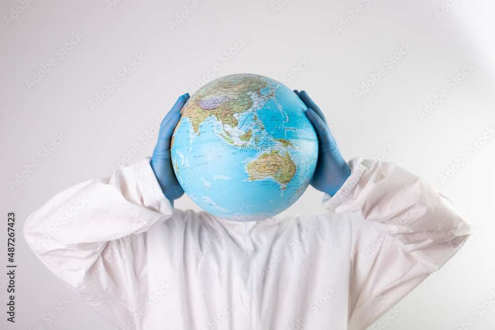 Doctor holding the planet Earth instead of head. Doctor holding the planet Earth instead of head.