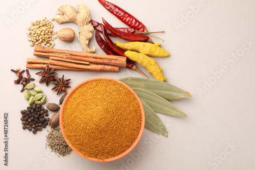 Fototapeta Naklejka Na Ścianę i Meble -  Curry Masala Powder with ingredients, this is a common spice ,curry powder in Indian kitchen