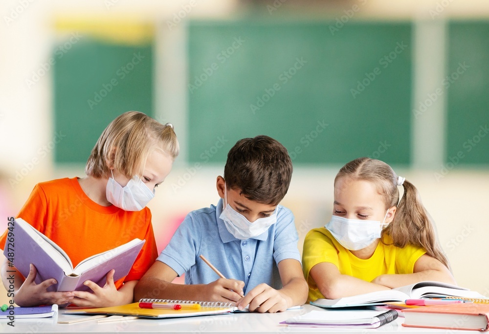 Group of children with face mask back at school after covid-19 and lockdown. Group of children with face mask back at school after covid-19 and lockdown.