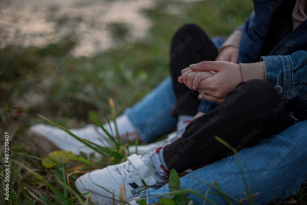 A child's hand in a mother's hand A child's hand in a mother's hand
