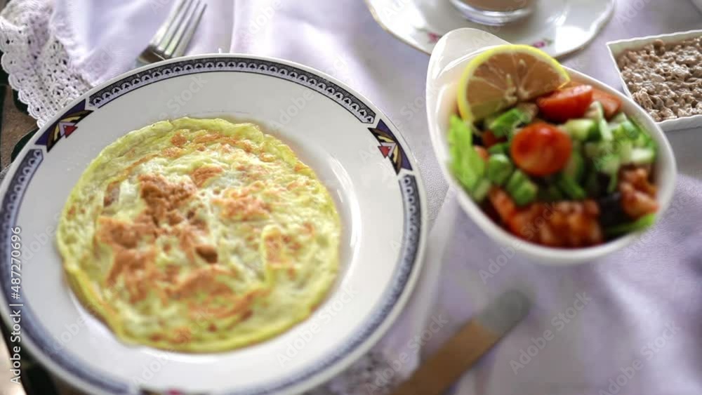Thick fluffy omelette with green fruits salad hotel food Thick fluffy omelette with green fruits salad hotel food