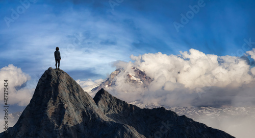 Adventurous Adult Female Hiker on top of Rocky Mountain with hands open. 3D Rendering Peak. Sunset Sky. Aerial Background from British Columbia, Canada. Adventure Sport Concept