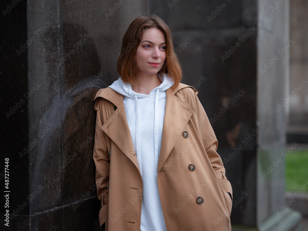 Beautiful woman walk in autumn cloudy Moscow. Street style. Travel to Russia concept. Beautiful woman walk in autumn cloudy Moscow. Street style. Travel to Russia concept.