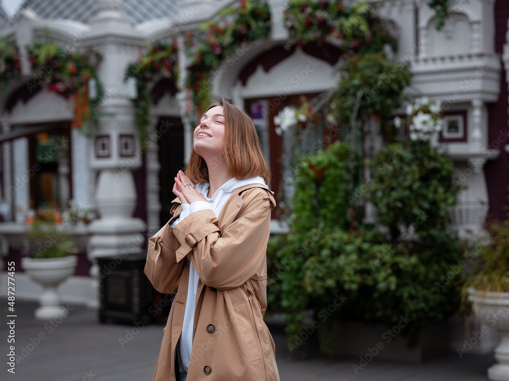 Beautiful woman walk in autumn cloudy Moscow. Street style. Travel to Russia concept.