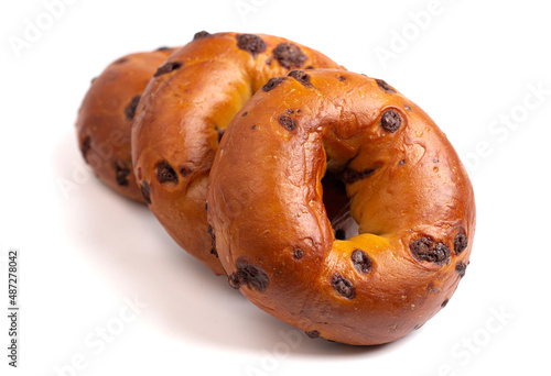 Three Golden Chocolate Chip Bagel on a White Background photo