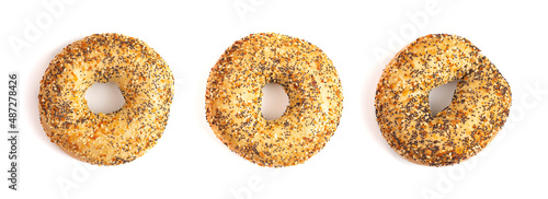 A Row of Three Evertything Bagels Isolated on a White Background photo