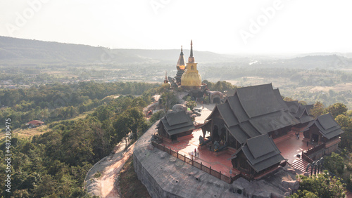 Wat Somdet Phu Ruea Ming Mueang Temple 4k fly over aerial view. Temple is built with fine wood timber. The church is made of teak and locate on mountain and best viewpoint at Phu ruea, Loei, Thailand
