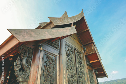 Loei, Thailand 12,2021 Wat Somdet Phu Ruea Ming Mueang (Temple) The temple is built with fine wood timber. The church is made of teak and locate on mountain and one of top viewpoint at Phu ruea. photo