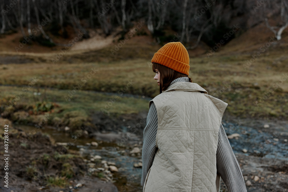 Naklejka premium woman in autumn clothes nature trees travel landscape