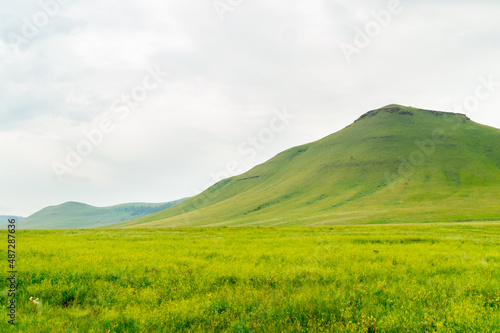 Beautiful steppe landscape: meadow, hills and sky. Khakassia, Russia.
