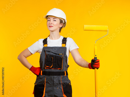 Woman in painting suit. Gir...