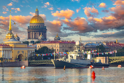 Saint Petersburg panorama. Russia Navy. Ships in Neva River. Warship near Admiralty building. Holiday navy in Saint Petersburg. Dome of St. Isaac's Cathedral in front of sky. Vacation in Russia
