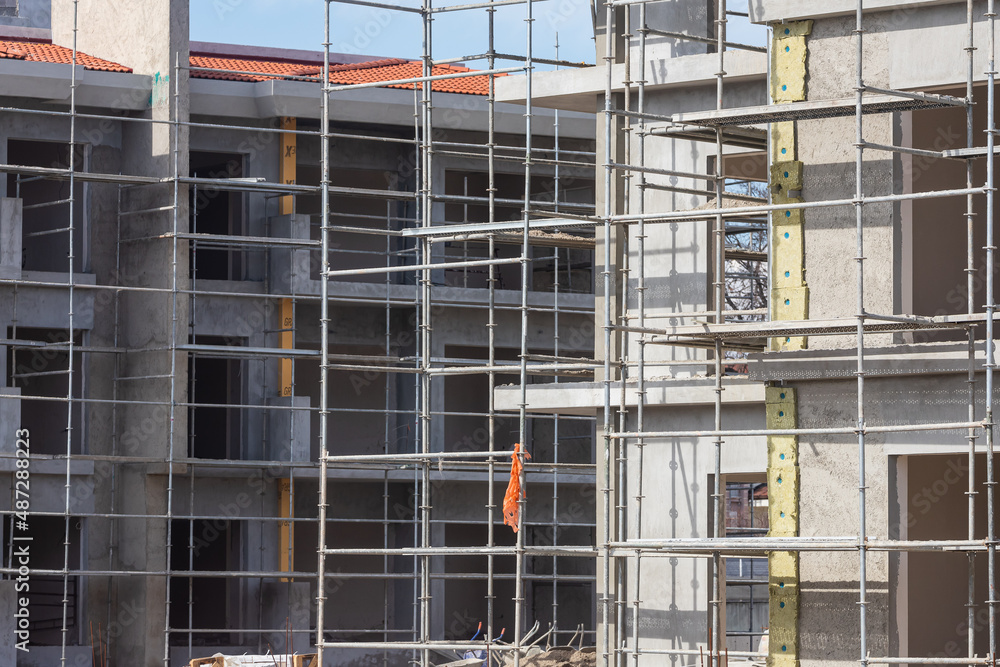 Close-up of the construction of a stone building. Construction of a new building in formwork