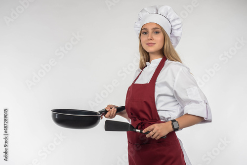 Chef with frying pan. Confi...