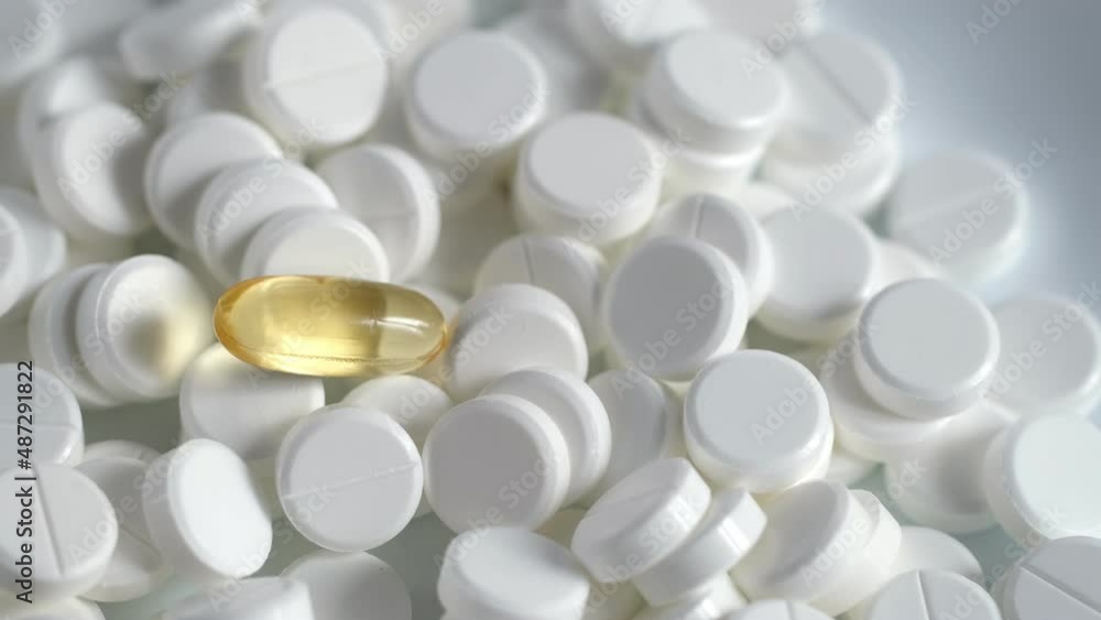 White medical pills rotating closeup. Pills and drugs. Pharmaceutical Industry. The medicine concept. 4K White medical pills rotating closeup. Pills and drugs. Pharmaceutical Industry. The medicine concept. 4K