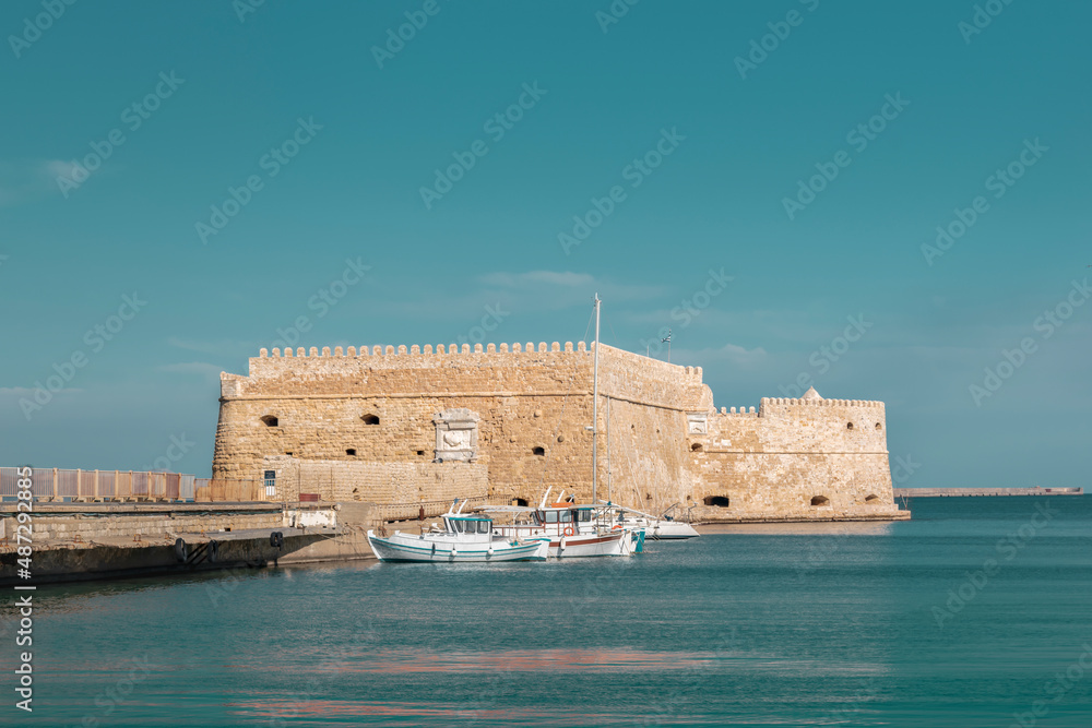 View of Venetian harbor Koules or Castello Mare fortress - symbol of Heraklion town at Crete, Greece. Old Fort on the Sea. Sightseeing of Greek island of Crete