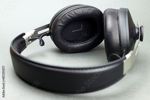 Wireless headphones with leather ear pads on a gray background