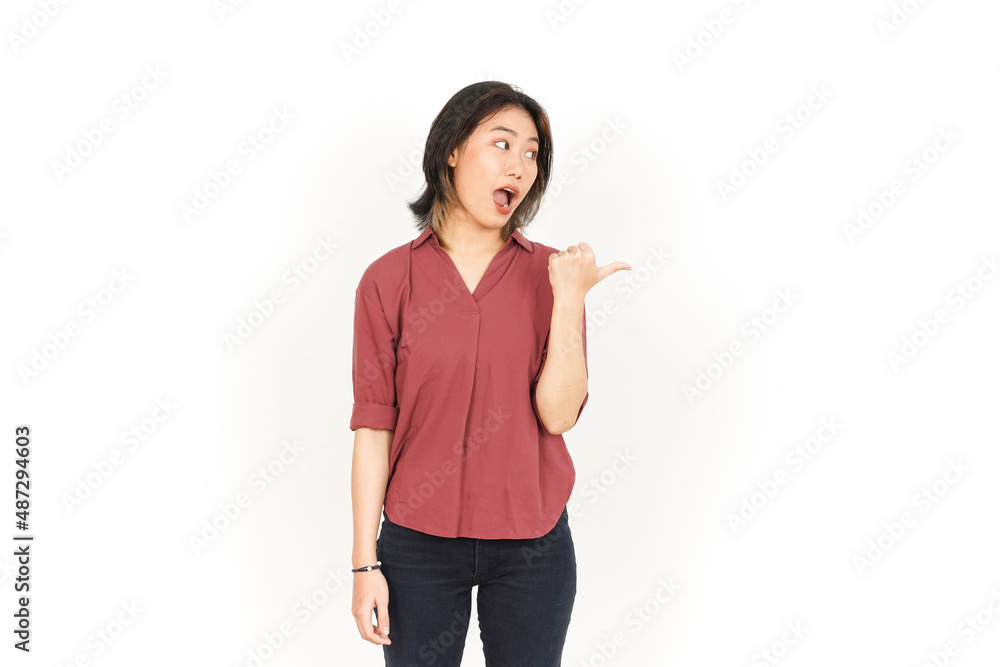 Showing and Pointing Product With Thumb Of Beautiful Asian Woman Isolated On White Background Showing and Pointing Product With Thumb Of Beautiful Asian Woman Isolated On White Background
