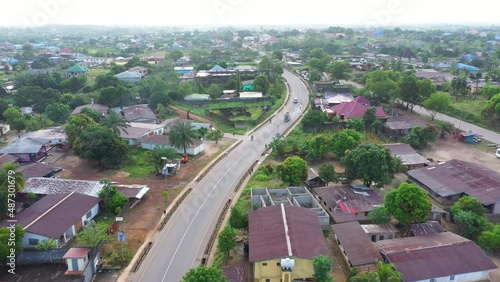 Aerial urban street follow traffic Bo Sierra Leone Africa. Sierra Leone on  coast of west Africa suffers extreme poverty and hunger. Tropical climate forest, jungle, mountain photo