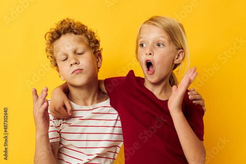 cheerful children casual wear games fun together on colored background