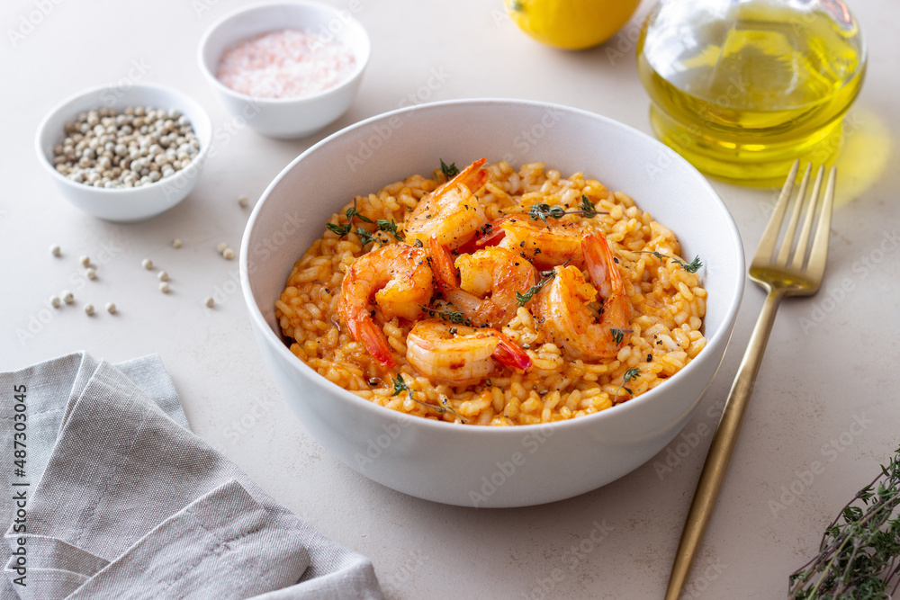 Risotto with shrimps, tomatoes and thyme. Italian food. Risotto with shrimps, tomatoes and thyme. Italian food.