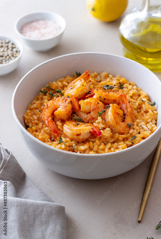 Risotto with shrimps, tomatoes and thyme. Italian food. Risotto with shrimps, tomatoes and thyme. Italian food.