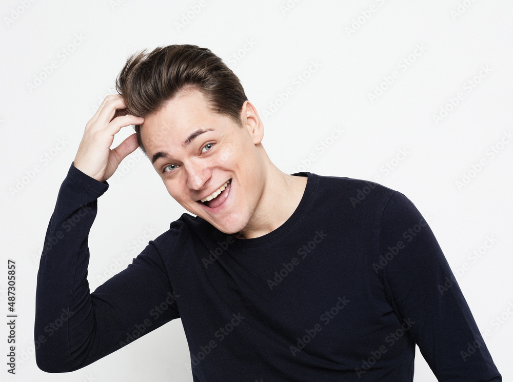 Close-up portrait of handsome adult man with beaming smile, looking camera satisfied, feel upbeat and enthusiastic Close-up portrait of handsome adult man with beaming smile, looking camera satisfied, feel upbeat and enthusiastic