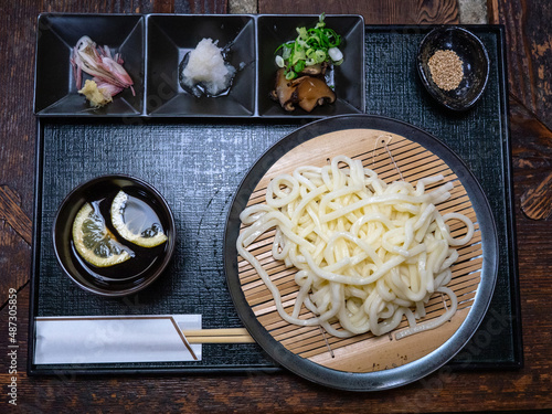 Saru cold udon ramen serve in a set with different side dishes and soup