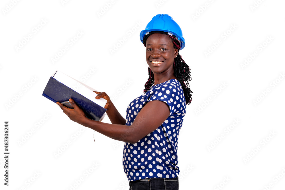young female engineer holding note book smiling. young female engineer holding note book smiling.