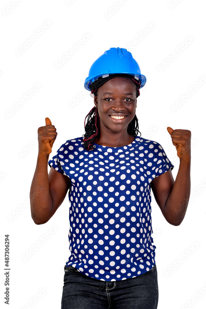 young happy female engineer making a winning gesture smiling. young happy female engineer making a winning gesture smiling.