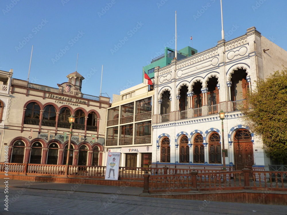 Naklejka premium Photograph taken on a sunny day around Iquique City at Chili, showing the architecture and colours of this historical place. The port, streets and the desert.