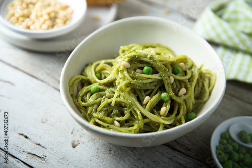 Spaghetti with pesto sauce and green pea