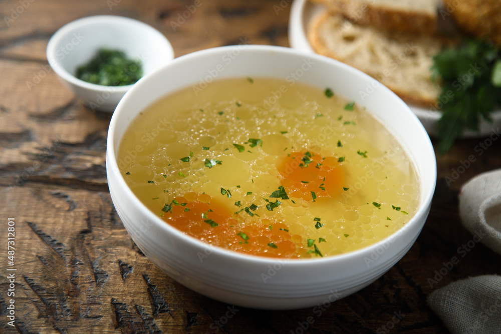 Traditional homemade chicken broth with vegetables Traditional homemade chicken broth with vegetables