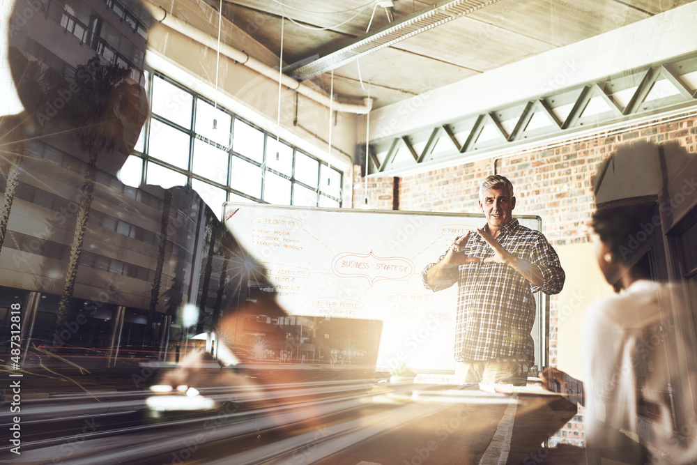 Designing their ambitious dreams. Multiple exposure shot of businesspeople having a meeting superimposed over a cityscape. Designing their ambitious dreams. Multiple exposure shot of businesspeople having a meeting superimposed over a cityscape.