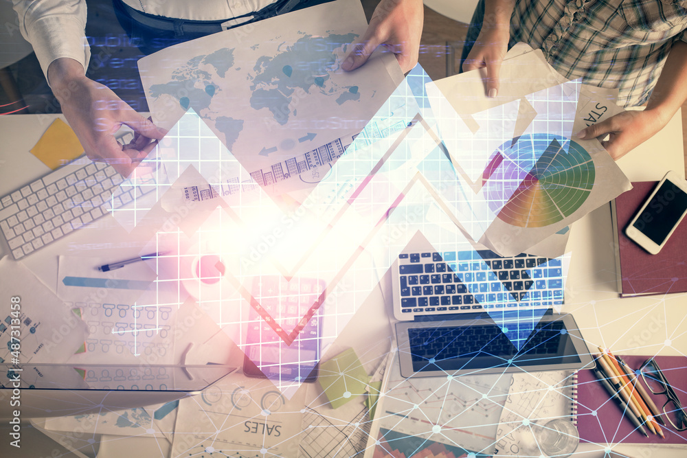 Double exposure of man and woman working together and arrows drawing. Computer background. Top View. Growth concept. Double exposure of man and woman working together and arrows drawing. Computer background. Top View. Growth concept.