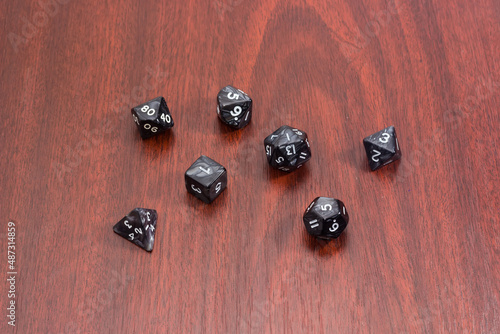 Wallpaper Mural Specialized polyhedral dice for role-playing games on red wooden table Torontodigital.ca